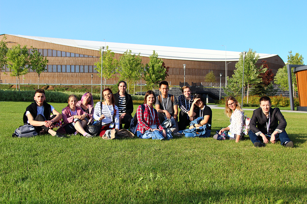 Maria Sokolova (in the center) and the summer school students with the new Skotlech Campus at the background. Photo: Yulia Gordeeva.